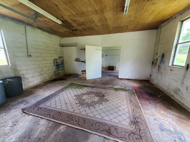 188 Bradford Hill Rd N, Brush Creek, TN 38547 - interior space featuring concrete floors and wood ceiling