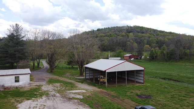 188 Bradford Hill Rd N, Brush Creek, TN 38547 - exterior space with a view of trees, an outbuilding, and driveway