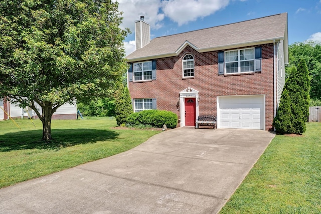 1244 Baker Creek Dr, Spring Hill, TN 37174 - colonial home with a front yard, a chimney, brick siding, an attached garage, and driveway
