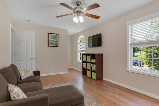 1244 Baker Creek Dr, Spring Hill, TN 37174 - living area with baseboards, light wood-style flooring, and ceiling fan