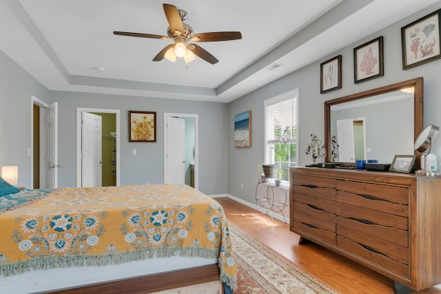 1244 Baker Creek Dr, Spring Hill, TN 37174 - bedroom with ceiling fan, visible vents, a raised ceiling, baseboards, and light wood finished floors