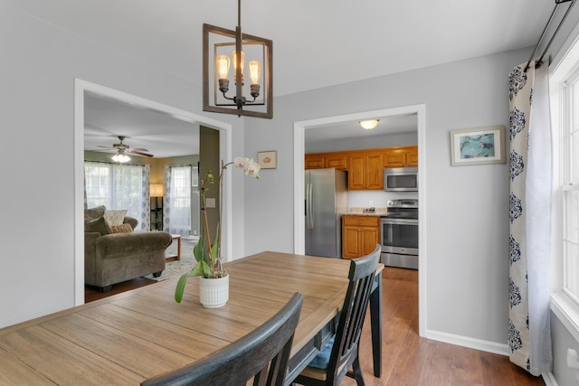 1244 Baker Creek Dr, Spring Hill, TN 37174 - dining room featuring baseboards, ceiling fan with notable chandelier, and wood finished floors