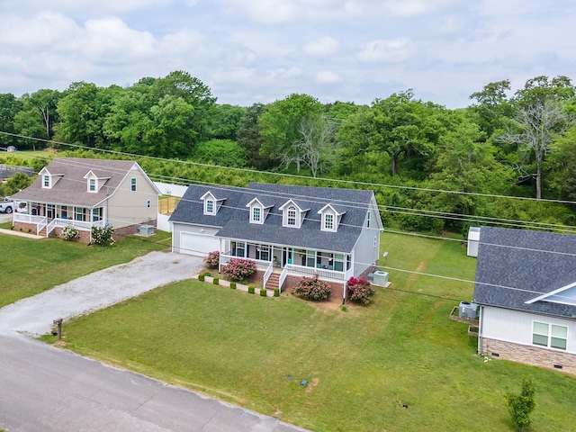 846 Todd Ave, Lewisburg, TN 37091 - view of front of home featuring a porch, roof with shingles, a front yard, dirt driveway, and a view of trees
