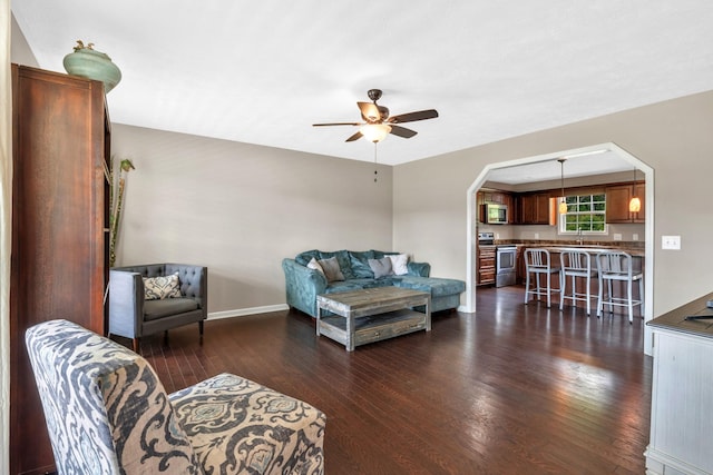 846 Todd Ave, Lewisburg, TN 37091 - living area featuring baseboards, ceiling fan, dark wood finished floors, and arched walkways
