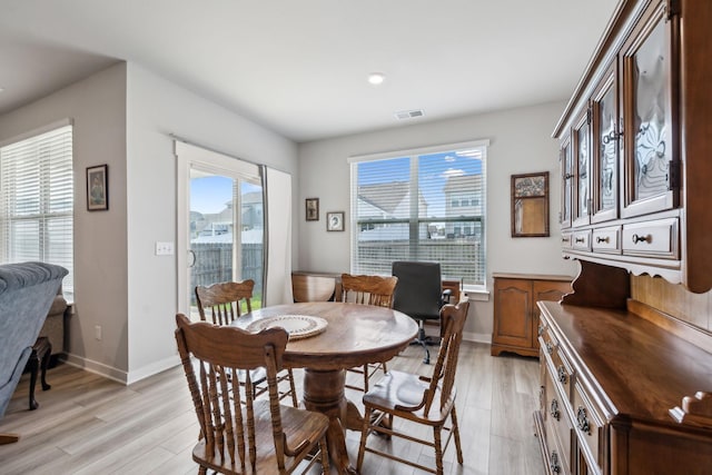 dining area featuring recessed lighting, baseboards, visible vents, and light wood-type flooring
