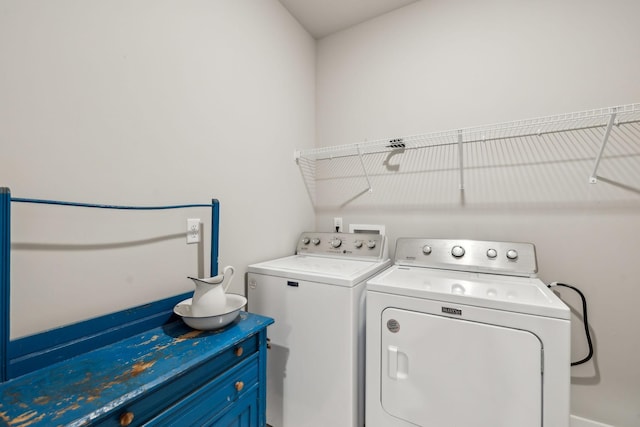 laundry room featuring laundry area and washer and clothes dryer