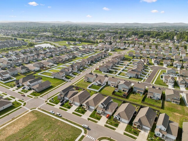 birds eye view of property with a residential view
