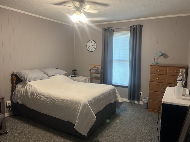 bedroom with ornamental molding, multiple windows, dark colored carpet, and ceiling fan
