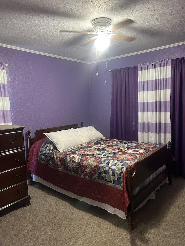 carpeted bedroom featuring a ceiling fan and ornamental molding