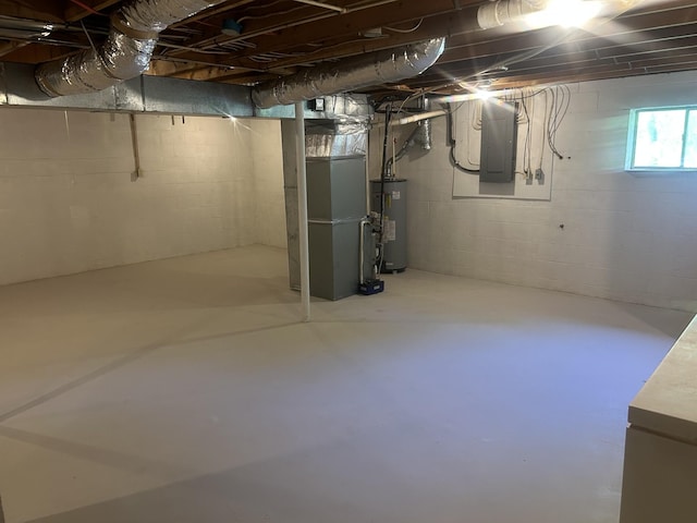 below grade area with water heater, heating unit, and electric panel