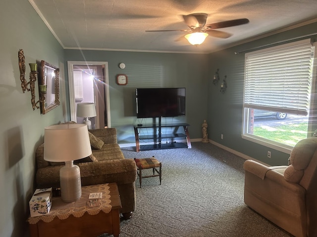 carpeted living room featuring a ceiling fan, baseboards, and ornamental molding