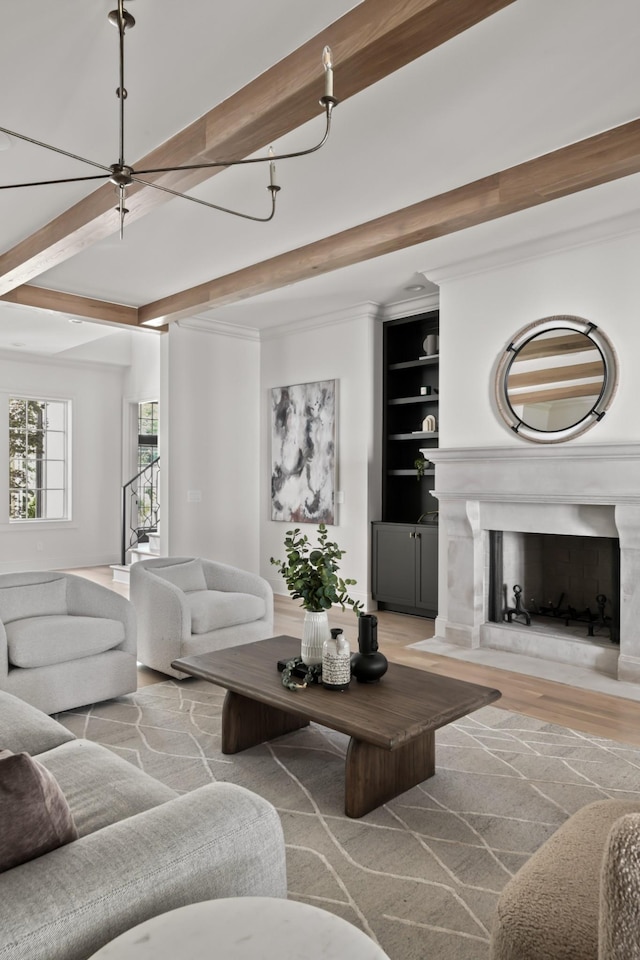1105 Brookmeade Dr, Nashville, TN 37204 - living room with crown molding, wood finished floors, a fireplace, and beamed ceiling