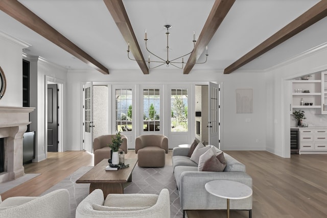1105 Brookmeade Dr, Nashville, TN 37204 - living area featuring beamed ceiling, beverage cooler, baseboards, light wood finished floors, and a notable chandelier