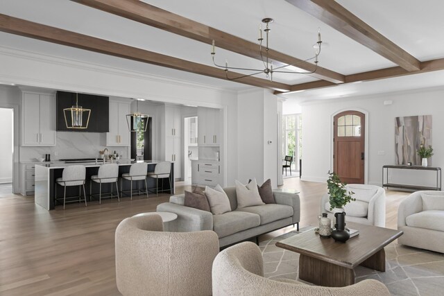 1105 Brookmeade Dr, Nashville, TN 37204 - living room with beamed ceiling, light wood-style flooring, and a chandelier