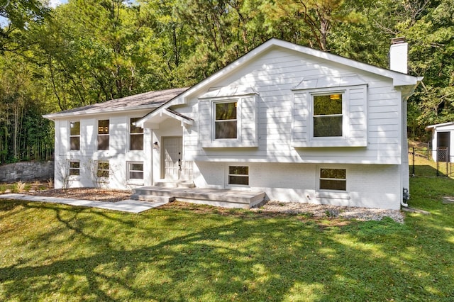 6556 Jocelyn Hollow Rd, Nashville, TN 37205 - view of front of home with fence, a chimney, brick siding, and a front yard