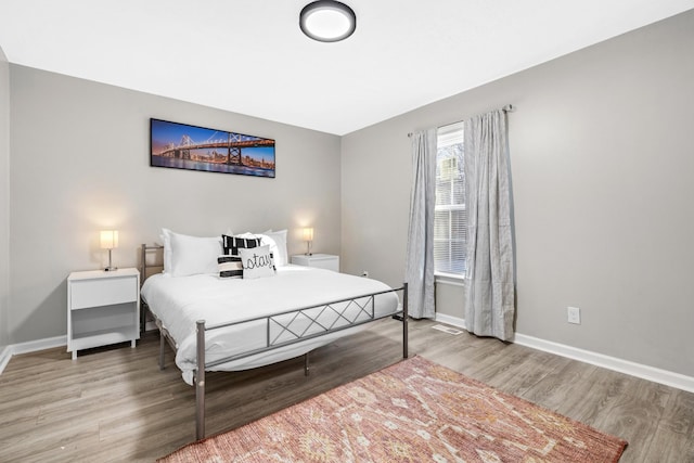 2821 Old Matthews Rd, Nashville, TN 37207 - bedroom with baseboards, wood finished floors, and visible vents