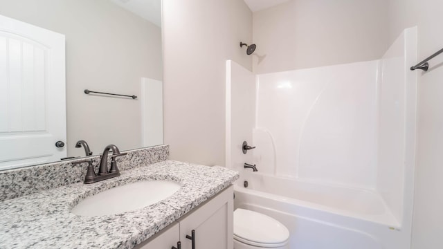 full bath with bathing tub / shower combination, vanity, and toilet