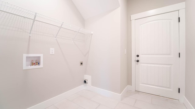 washroom with hookup for an electric dryer, laundry area, baseboards, hookup for a washing machine, and light tile patterned flooring