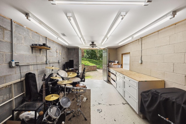 1353 Stewart Creek Rd, Murfreesboro, TN 37129 - miscellaneous room with a ceiling fan, concrete flooring, and concrete block wall