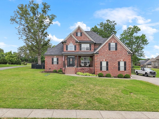 1353 Stewart Creek Rd, Murfreesboro, TN 37129 - view of front of home with brick siding, a front lawn, a porch, and a shingled roof