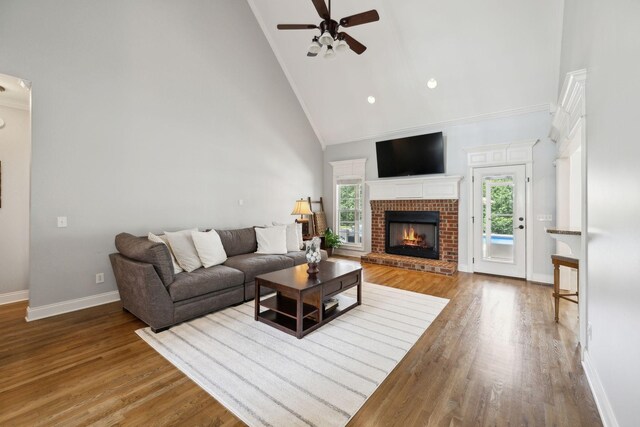 1353 Stewart Creek Rd, Murfreesboro, TN 37129 - living room with high vaulted ceiling, ceiling fan, ornamental molding, baseboards, and a brick fireplace