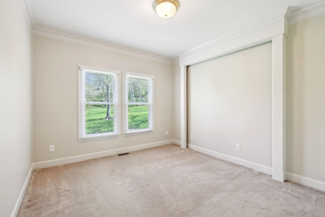 1403 Sneed Rd W, Franklin, TN 37069 - empty room featuring carpet flooring, baseboards, visible vents, and ornamental molding