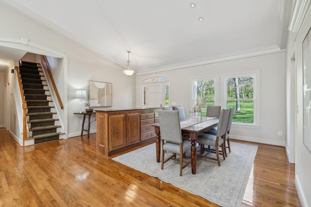 1403 Sneed Rd W, Franklin, TN 37069 - dining space featuring crown molding, lofted ceiling, wood finished floors, baseboards, and stairway