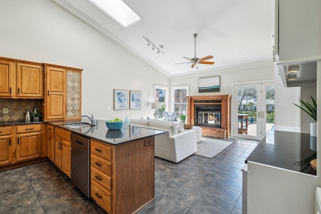 1403 Sneed Rd W, Franklin, TN 37069 - kitchen with decorative backsplash, crown molding, stainless steel dishwasher, a sink, and a peninsula