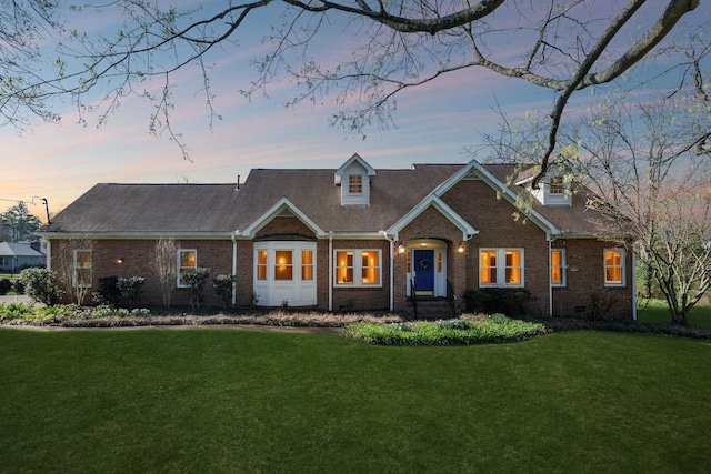 1403 Sneed Rd W, Franklin, TN 37069 - cape cod-style house with brick siding and a lawn