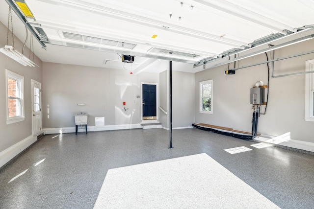 1403 Sneed Rd W, Franklin, TN 37069 - garage featuring baseboards and a garage door opener