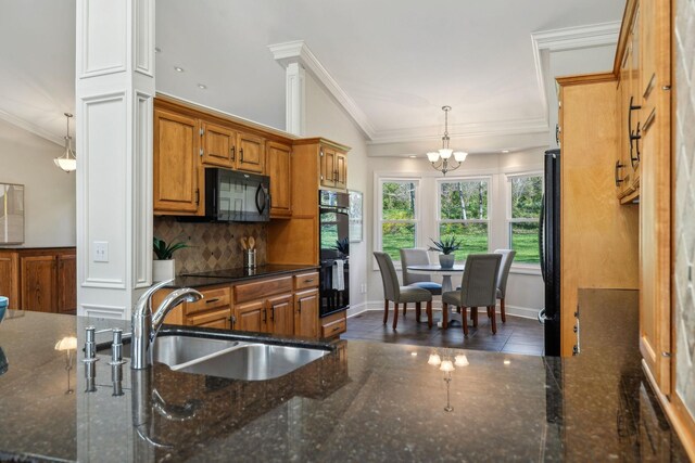 1403 Sneed Rd W, Franklin, TN 37069 - kitchen featuring crown molding, a sink, backsplash, and black appliances