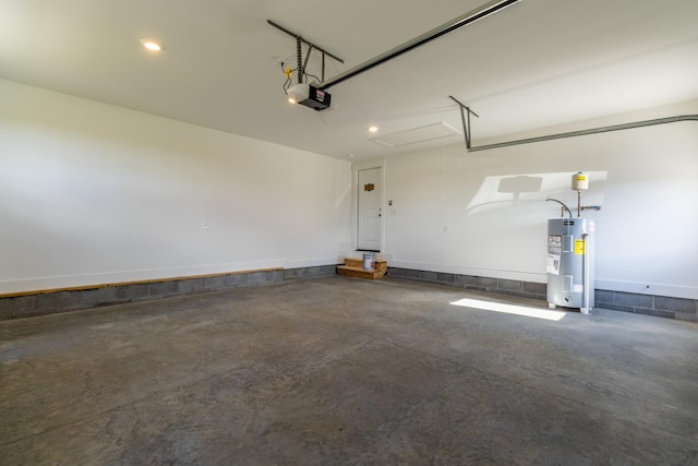 5367 Roy Holman Rd, Springfield, TN 37172 - garage with water heater and a garage door opener