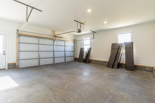 5367 Roy Holman Rd, Springfield, TN 37172 - garage featuring a garage door opener, recessed lighting, and baseboards