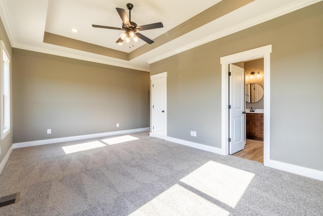 5367 Roy Holman Rd, Springfield, TN 37172 - unfurnished bedroom with light carpet, ornamental molding, a raised ceiling, baseboards, and ensuite bath