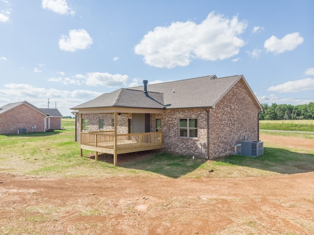5367 Roy Holman Rd, Springfield, TN 37172 - back of house with brick siding, central AC unit, a wooden deck, and a yard