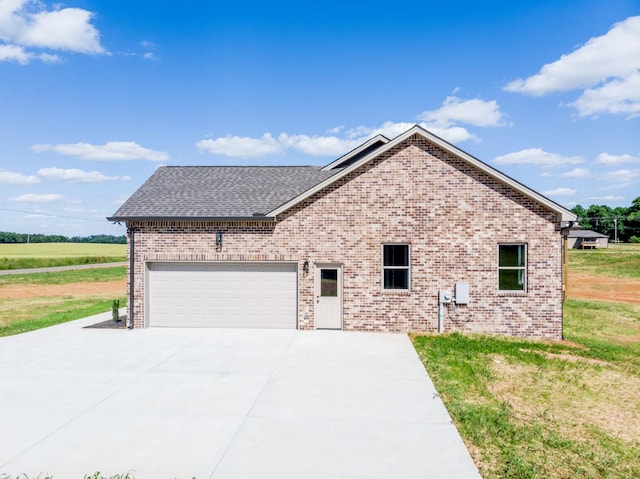 5367 Roy Holman Rd, Springfield, TN 37172 - view of front of house with driveway, brick siding, an attached garage, roof with shingles, and a front yard