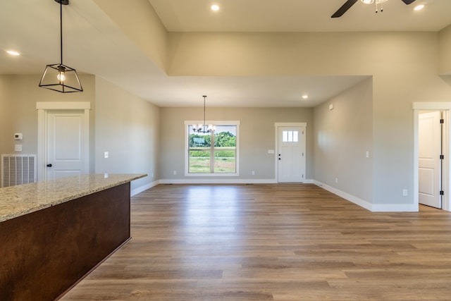 5367 Roy Holman Rd, Springfield, TN 37172 - unfurnished living room featuring a ceiling fan, wood finished floors, baseboards, a chandelier, and recessed lighting