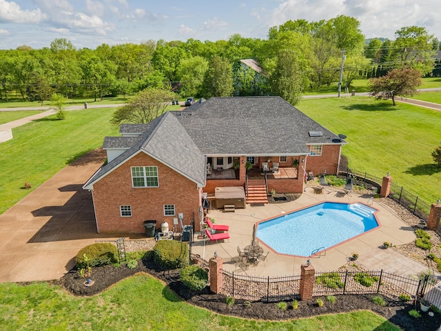 view of pool featuring a fenced in pool, a fenced backyard, a patio area, and a yard