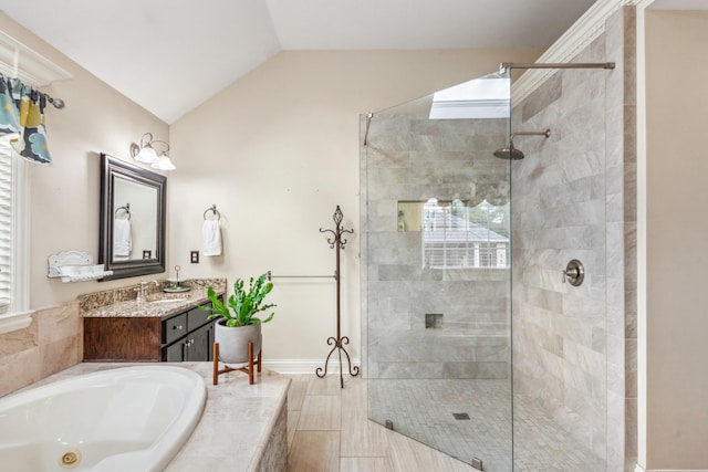 full bathroom featuring a bath, a shower stall, vanity, baseboards, and lofted ceiling