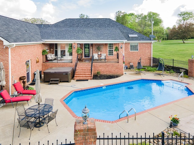 view of pool featuring fence private yard, a hot tub, a patio area, and a fenced in pool