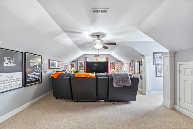 carpeted cinema with a ceiling fan, baseboards, decorative columns, vaulted ceiling, and visible vents