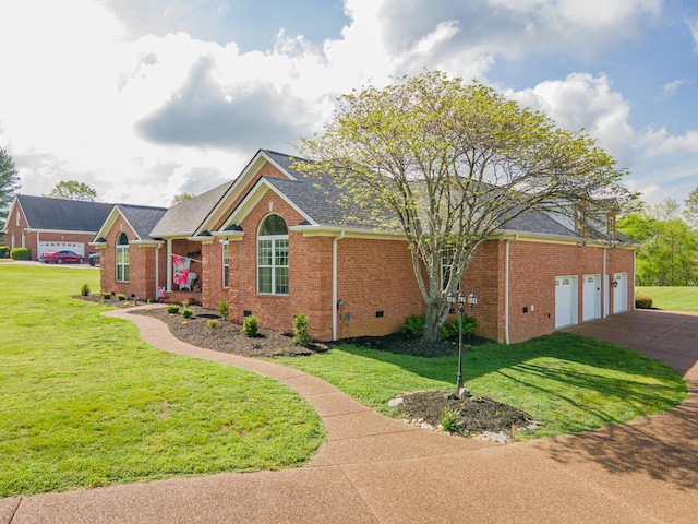 ranch-style house with concrete driveway, brick siding, and a front yard