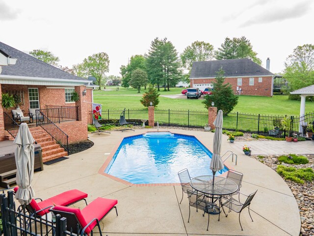 view of swimming pool featuring stairs, a fenced in pool, a fenced backyard, a patio area, and a yard