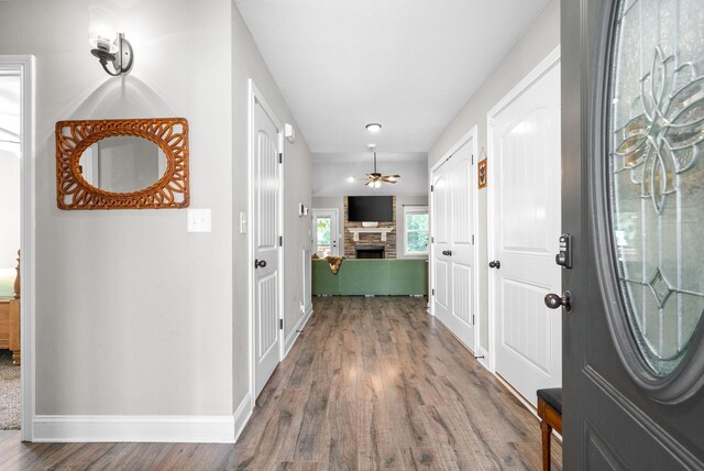1804 Rains Rd, Clarksville, TN 37042 - entrance foyer featuring baseboards, ceiling fan, wood finished floors, and a fireplace