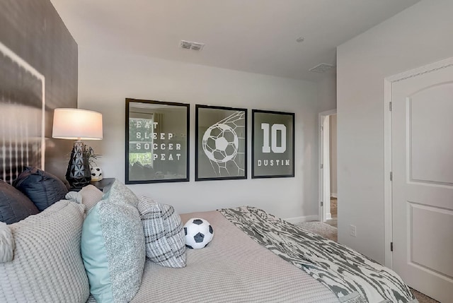 bedroom with visible vents and carpet floors