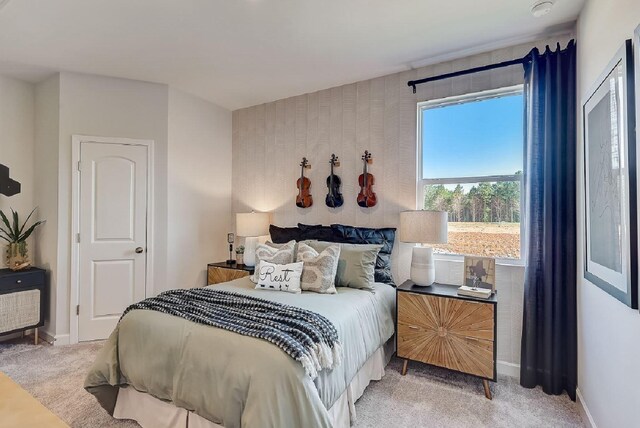carpeted bedroom with baseboards