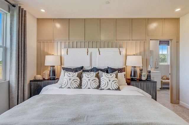 bedroom with recessed lighting and light carpet