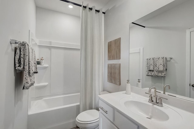 bathroom with vanity, shower / bath combo, and toilet