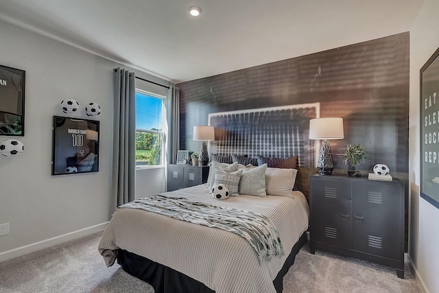 bedroom with baseboards and carpet