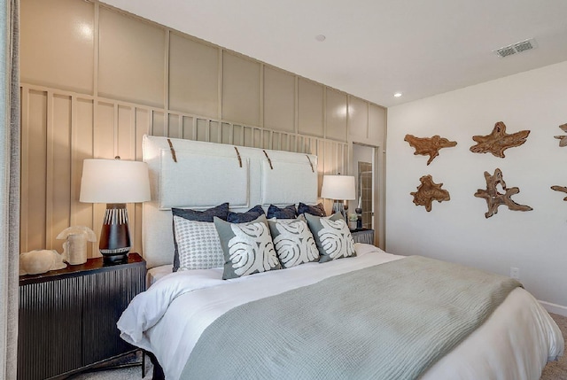 bedroom featuring carpet flooring, baseboards, and visible vents